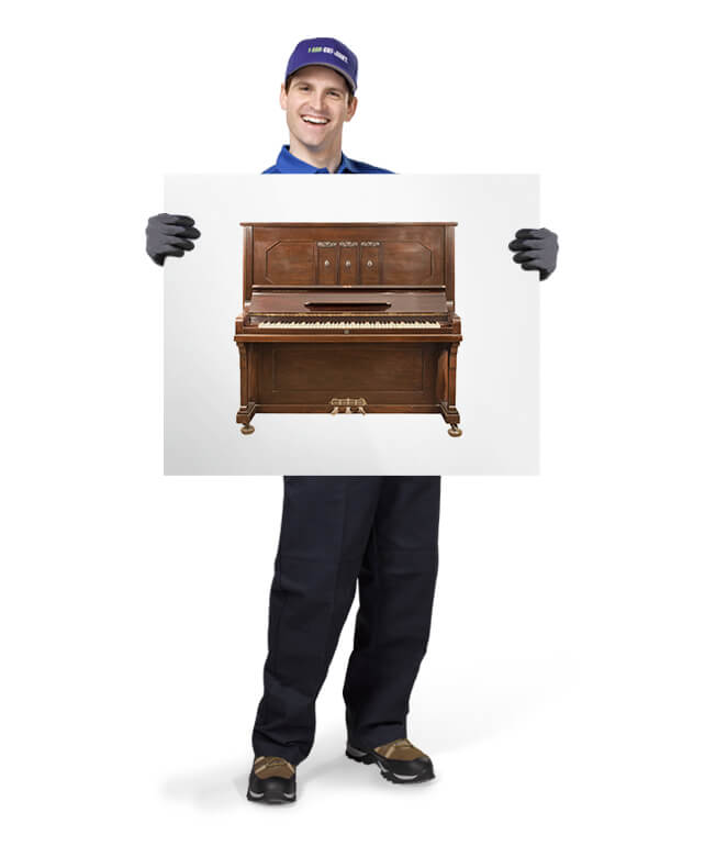 Pianos for removal and disposal by 1-800-GOT-JUNK? truck team member