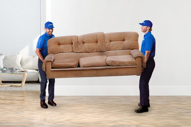 1800-GOT-JUNK? Truck Team Members hauling away a couch