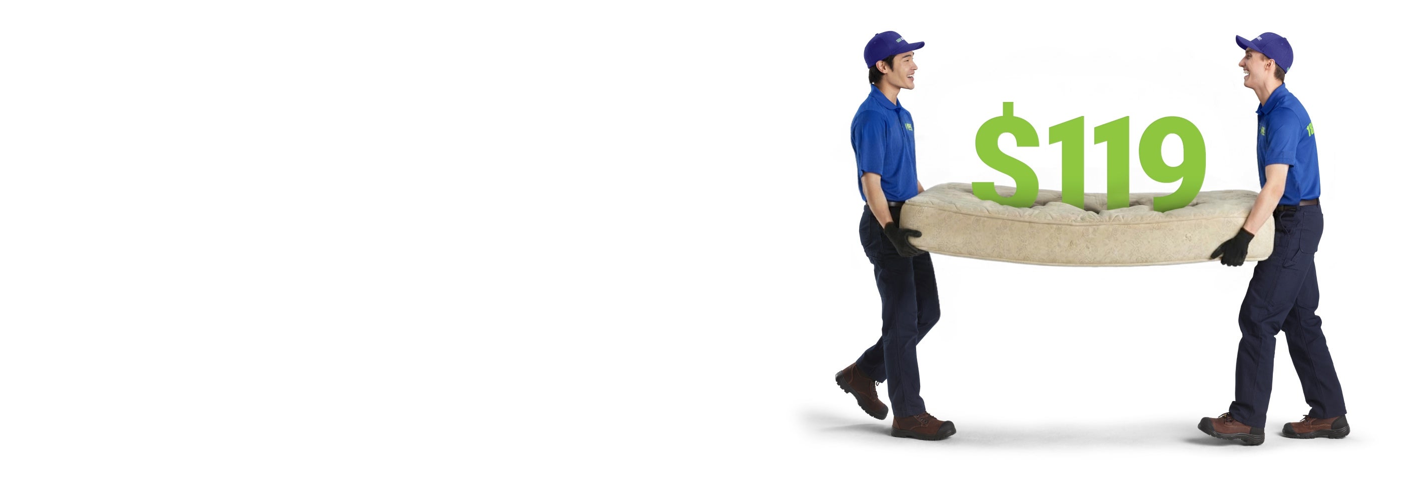 Two team members carrying a mattress