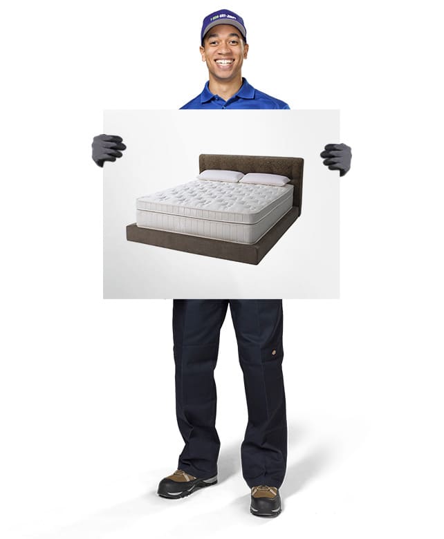 1800-GOT-JUNK? Truck Team Member holding an image of a bed