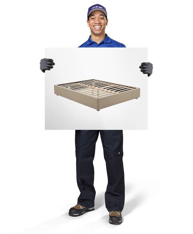1800-GOT-JUNK? Truck Team Member holding an image of a box spring
