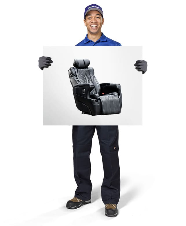 1800-GOT-JUNK? Truck Team Member holding an image of a massage chair