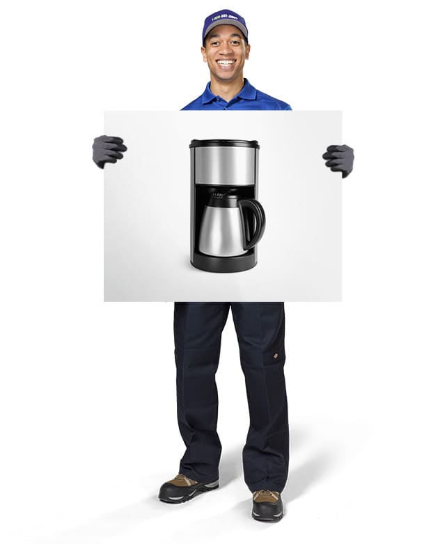 1800-GOT-JUNK? Truck Team Member holding an image of a coffee machine