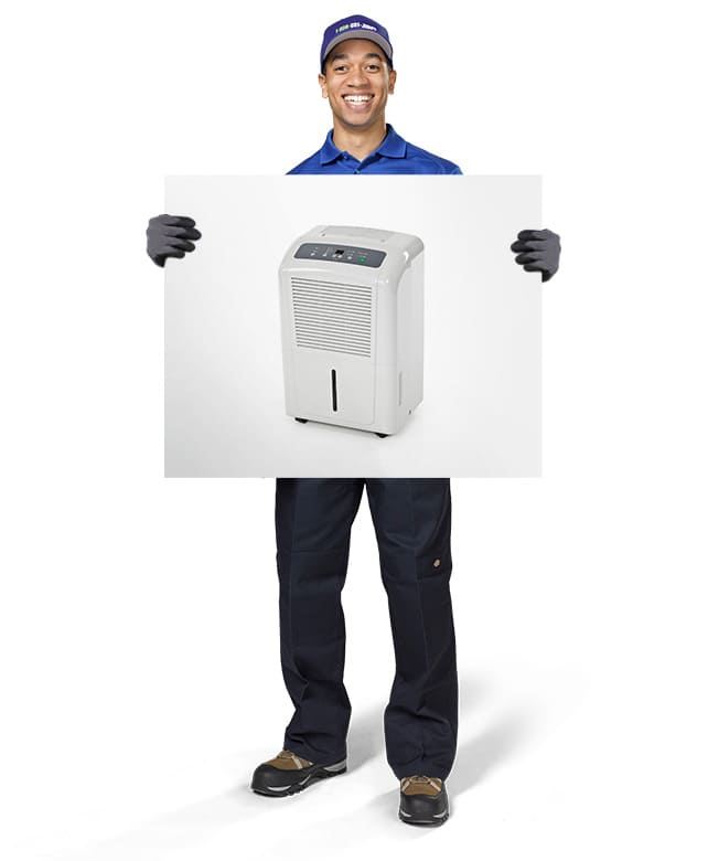 1800-GOT-JUNK? Truck Team Member holding an image of a dehumidifier