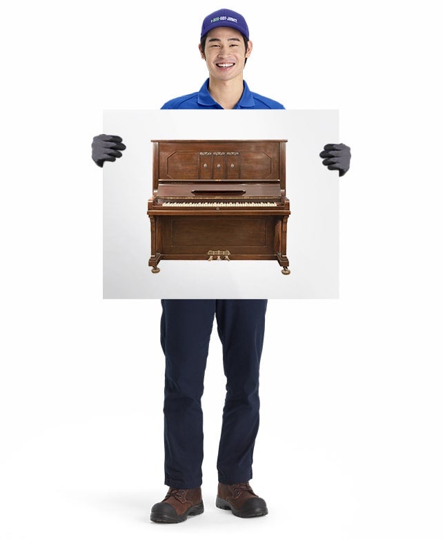 Pianos for removal and disposal by 1-800-GOT-JUNK? truck team member