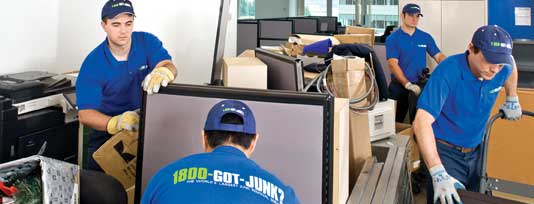 Truck team members cleaning out an office